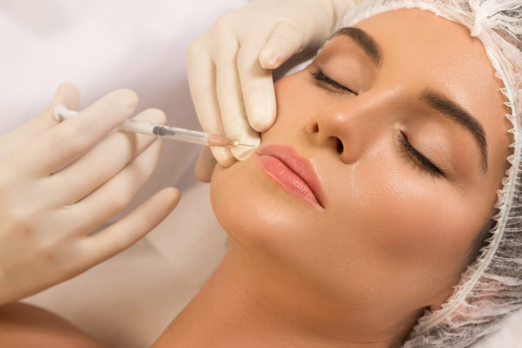 Woman during lips augmentation procedure | Avid Aesthetics and Wellness | Puyallup, Washington