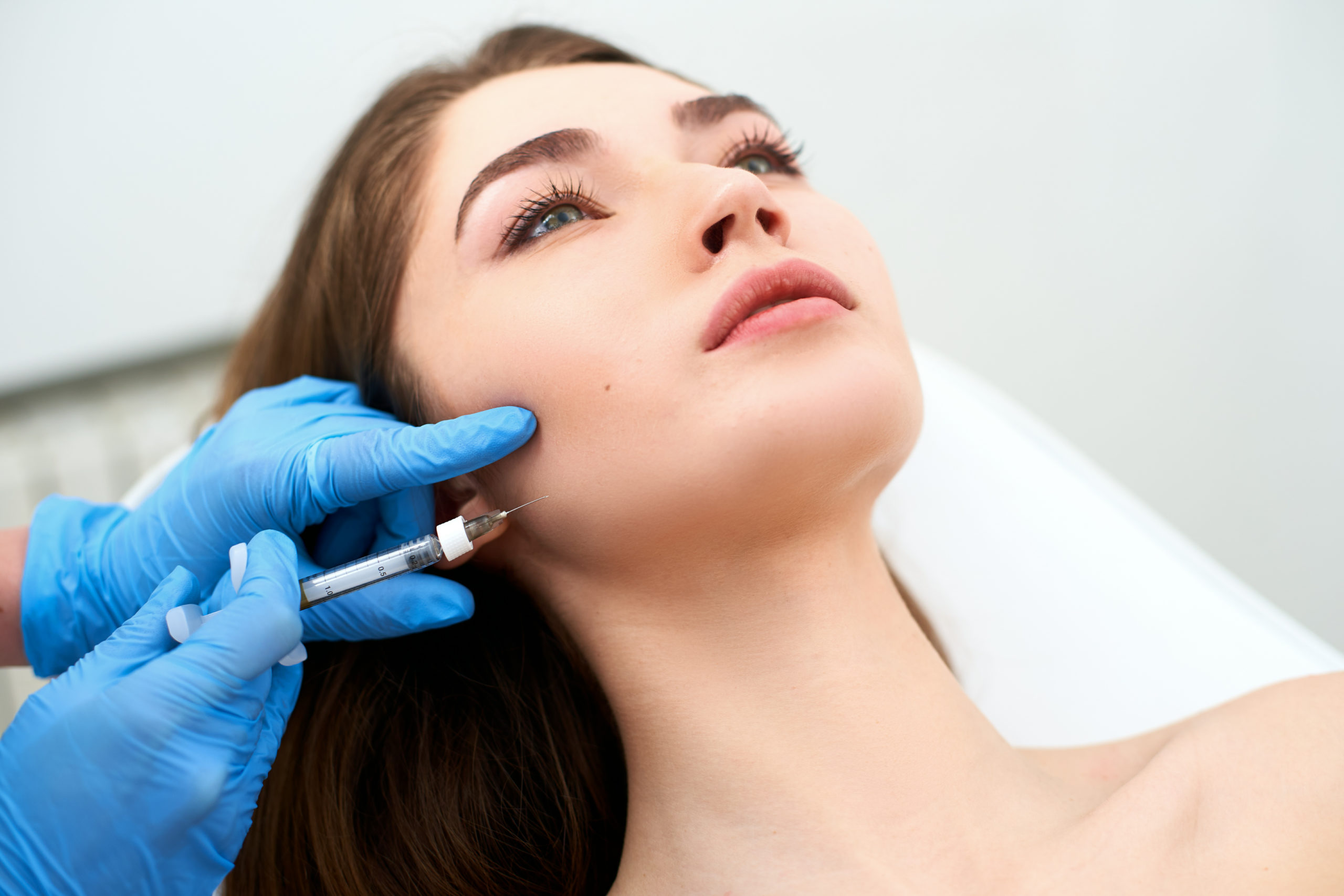 Woman taking Dermal Filler treatment - What are the Benefits of Dermal Fillers | Avid Aesthetics and Wellness | Puyallup, Washington